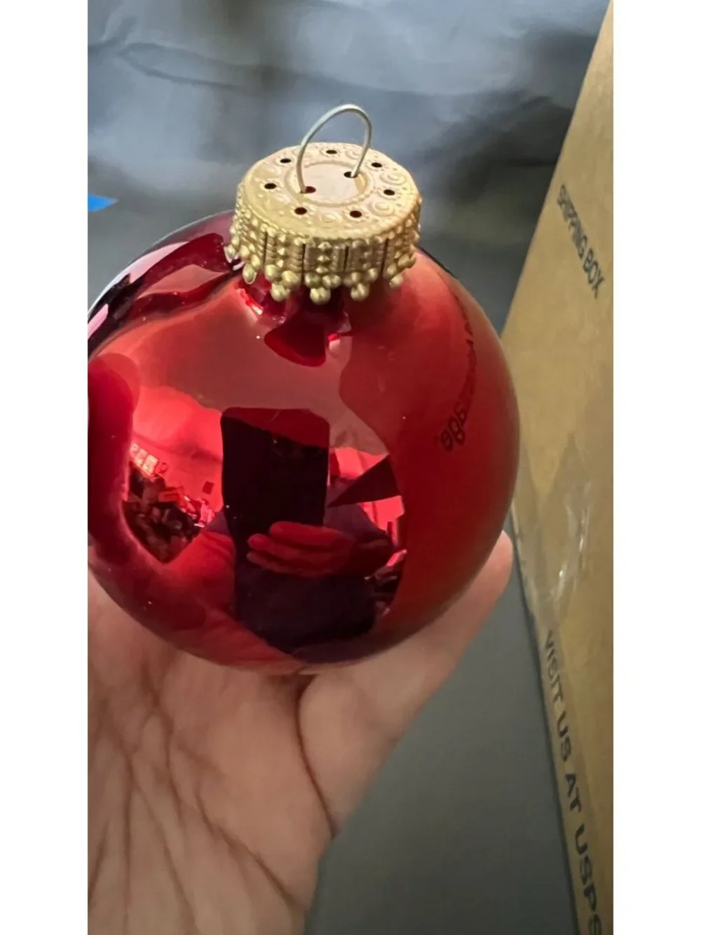 Shiny Red & Gold Christmas Ornaments In Wicker Basket
